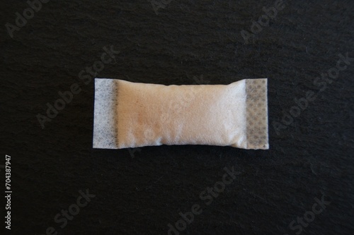 Nicotine pouch on a dark background. Snus tobacco product. High quality photo