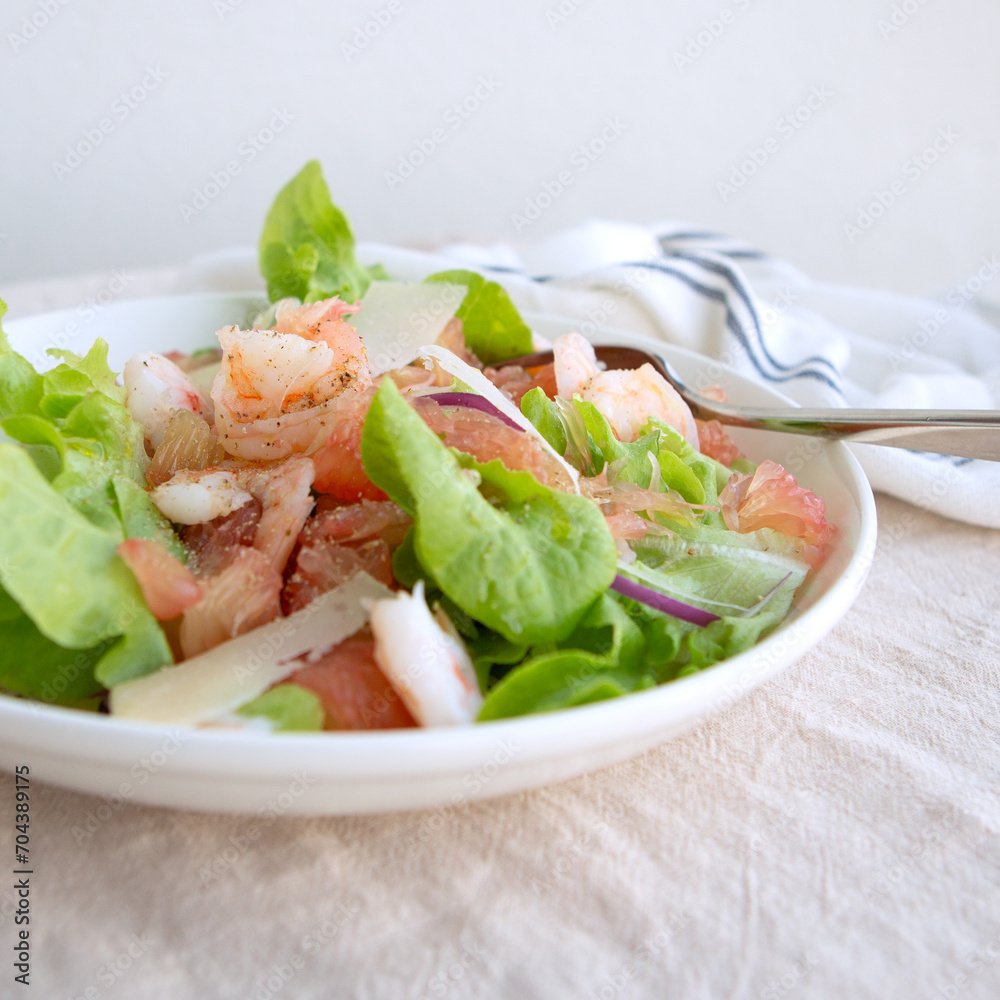 bowl with salad with pomelo and shrimp on the table bowl with salad with pomelo and shrimp on the table