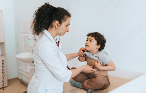 Pediatrician examining young patient  clinic setting  child healthcare focus