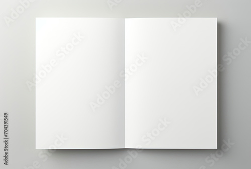 Open White Book on Gray Background