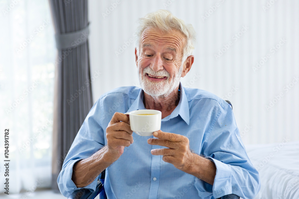 Senior caucasian man is drinking and enjoying his hot herbal tea in morning for healthy, longevity and retirement happiness Senior caucasian man is drinking and enjoying his hot herbal tea in morning for healthy, longevity and retirement happiness