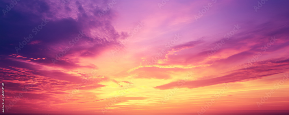 Vibrant purple, yellow and orange sky - Fantasy vibrant panoramic sunset sky - Gradient rich colors - ethereal dreamy summer sunset or sunrise sky. Uplifting and peaceful sky.