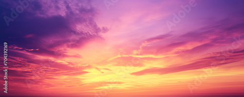 Vibrant purple, yellow and orange sky - Fantasy vibrant panoramic sunset sky - Gradient rich colors - ethereal dreamy summer sunset or sunrise sky. Uplifting and peaceful sky.