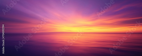Purple, orange and yellow sky over the sea - Fantasy vibrant panoramic sunset sky - Gradient rich colors - ethereal dreamy summer sunset or sunrise sky. Uplifting and peaceful sky.