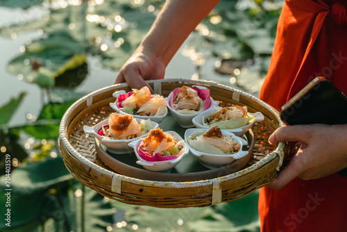 Miang Kham lotus petals-wrapped is a food that people is eaten as a snack. Lotus lotus petals are a new alternative to eating for health. Lotus flowers are not only edible. But also has many benefits. photo