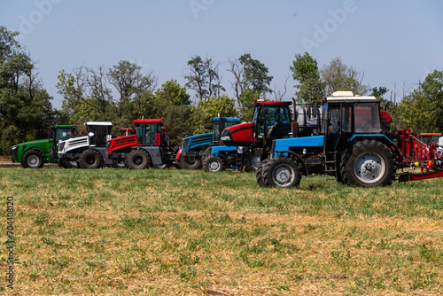 Agricultural tractors on a field