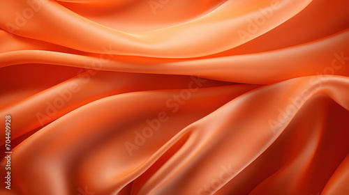 Close-up of a vibrant orange silk fabric, elegantly draped to showcase its luxurious texture and rich color.