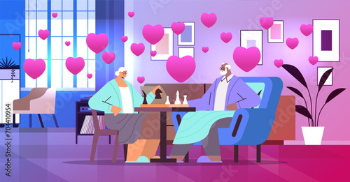 elderly couple in love playing chess senior man woman spending time together valentines day celebration concept