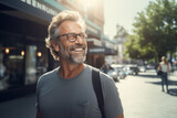 Middle aged man in the middle of the city with glasses