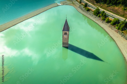 Curon Venosta. Submerged bell Tower in Graun im Vinschgau on Lake Reschen Alpine landscape aerial view photo