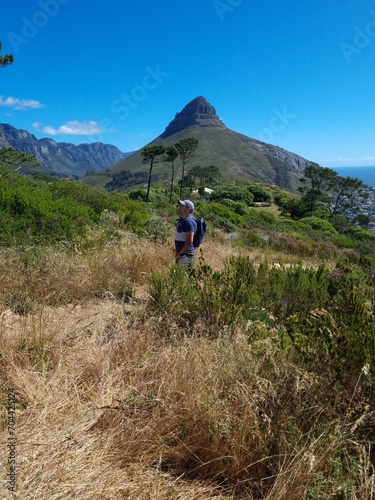 Man hiking in nature in front of Lions Head