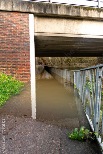 Fototapeta Naklejka Na Ścianę i Meble -  flooded footpath in watford UK. where the River colne has burst it banks