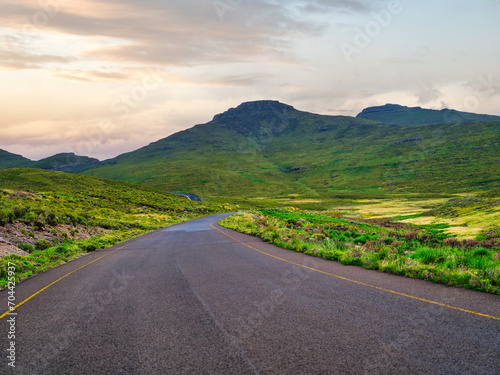 Winding road through beautiful valley surrounded by mountains in Lesotho