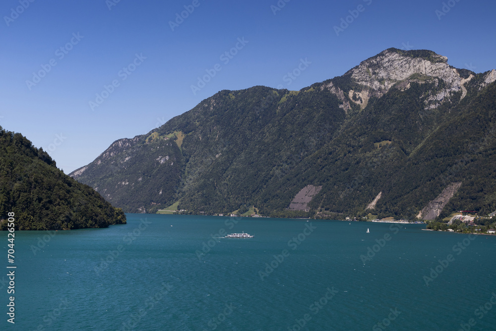 Beautiful summer view accross Lake Uri, an arm of Lake Lucerne. Looking towards Ingenbohl and Rigi Hochflue mountain in Switzerland. Swiss Alps landscape view with copy space.