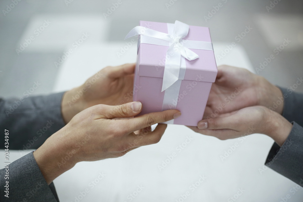 Cropped Hands Of Couple Holding Gift Box Cropped Hands Of Couple Holding Gift Box