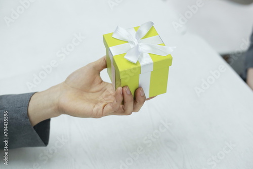Close up of man holding gift box