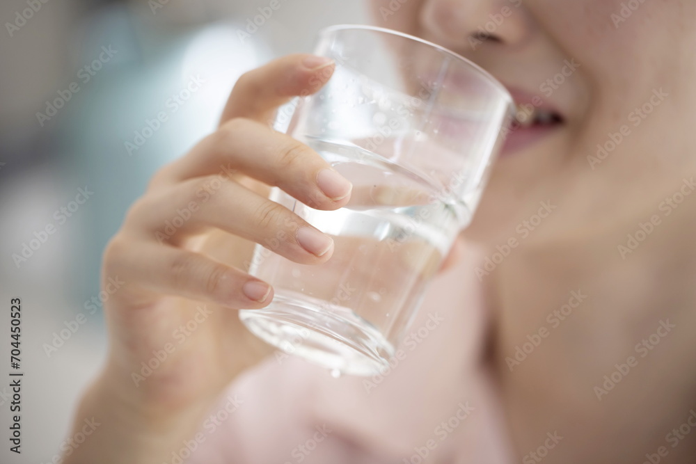Close up of woman drinking glass of water Close up of woman drinking glass of water