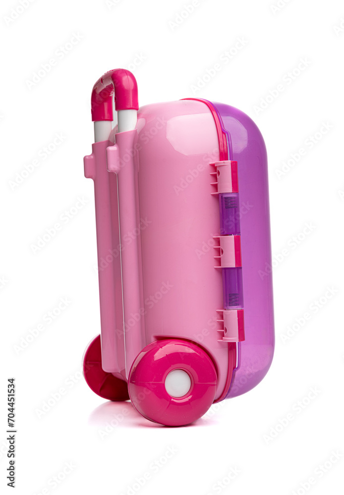 Children's plastic pink suitcase isolated on a white background.