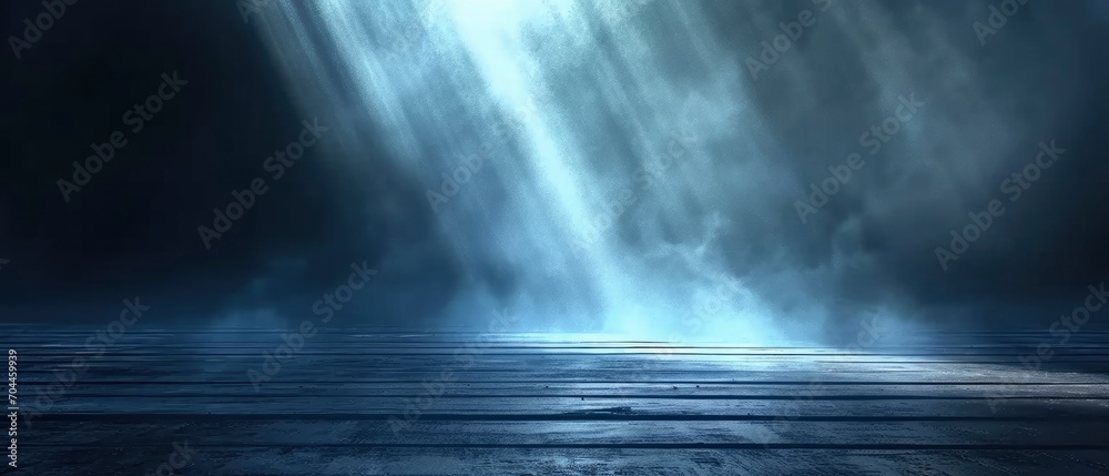 Wooden floor with dark black wall with blue lighting