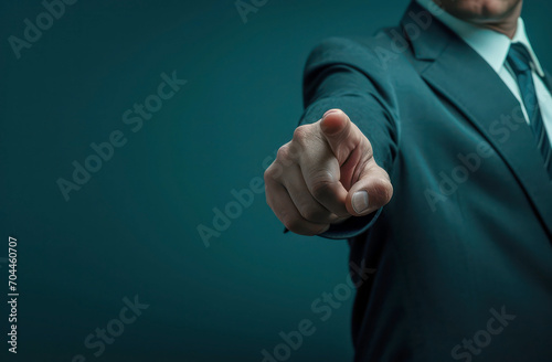 
Point of Decision. A man in a suit extends his finger directly towards the viewer, suggesting a choice or challenge photo