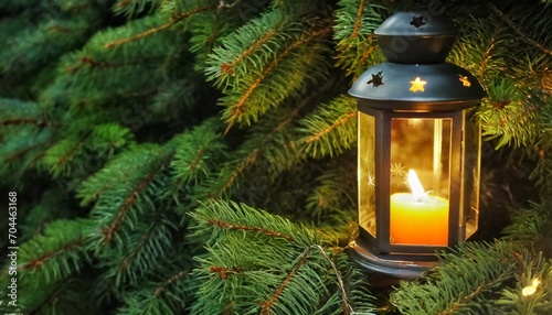 christmas lantern with burning candle on fir tree as background closeup space for text