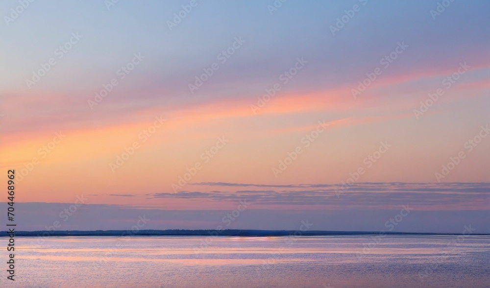 A soft sunset over a serene horizon with pastel colors.