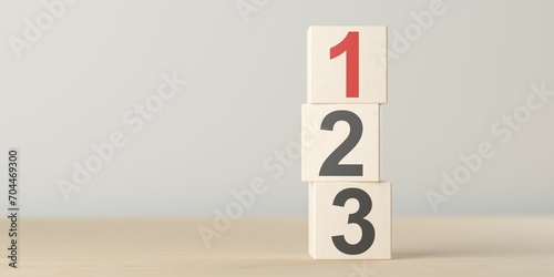 Numbers one, two and three on wooden blocks standing on table, plan, priority or winner business concept photo