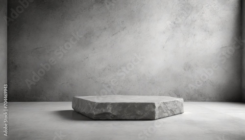 stone podium product placement layout in interior room with a white floor against a grey concrete wall