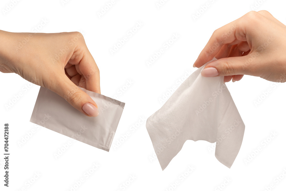 Wet wipe in a woman hand isolated on a white background. Wet wipe in a woman hand isolated on a white background.