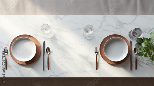 Top view of marble dinning table with white ceramic plates on placemat, photo