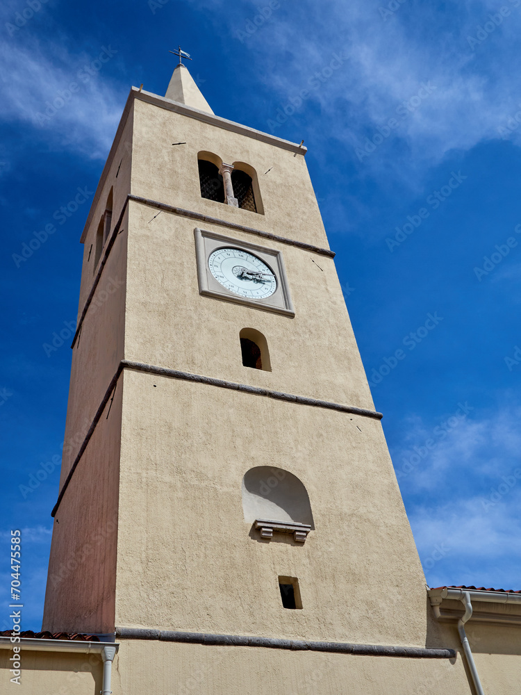 Close-up of the tower of the Church of St George over a bright blue sky. Lovran, Opatija Riviera, Primorje-Gorski Kotar County, Istria, Croatia, Europe