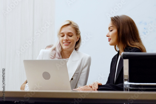 Beautiful female employee sitting and working in the office.