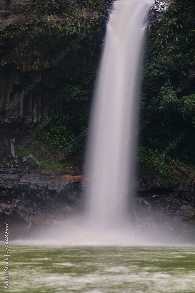 Low Shutter Speed Portrait: Vertical View of a Waterfall