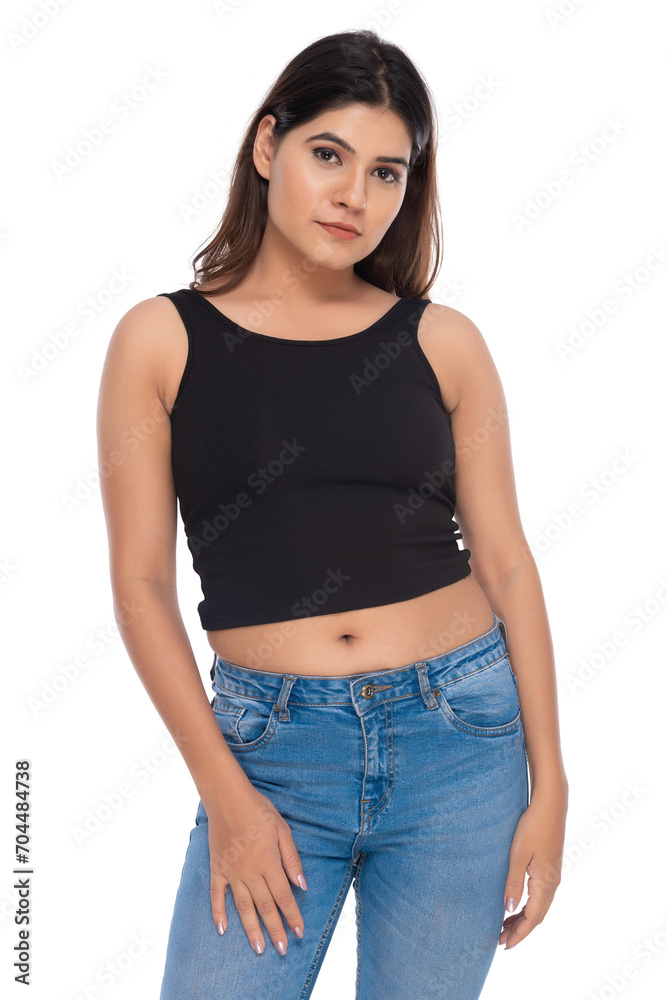 Young Indian girl wearing crochet top and jeans with elegant pose and expression Young Indian girl wearing crochet top and jeans with elegant pose and expression