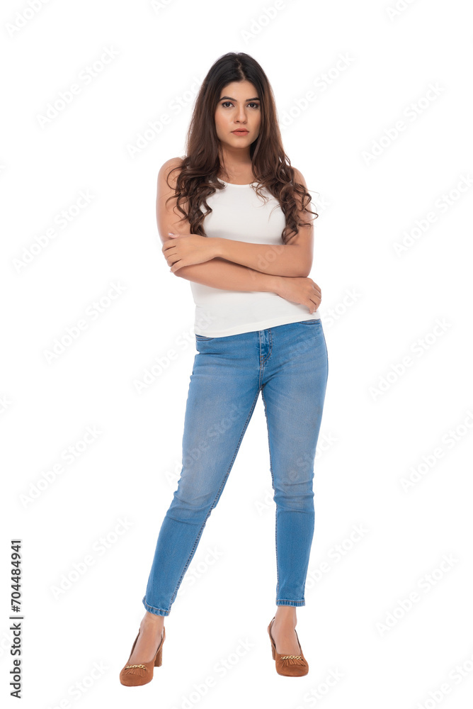 Young Indian girl wearing crochet top and jeans with elegant pose and expression Young Indian girl wearing crochet top and jeans with elegant pose and expression