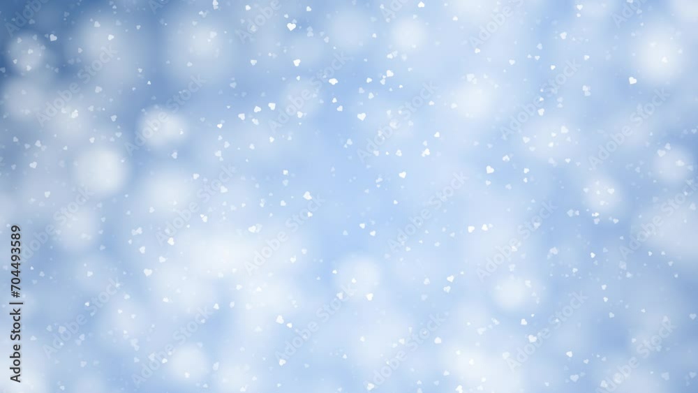 Small white hearts slow motion movement on blurred blue bokeh background. Small white hearts slow motion movement on blurred blue bokeh background.