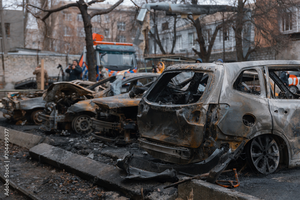Shahed blew up houses. A bombed residential building and burnt cars after the strike. War in Ukraine, the city of Dnipro. Burnt out car.