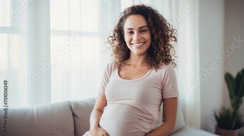 Free Download A photo of a gorgeous athletic woman who is happy and letting down resting on a couch after a yoga class - GFXLoad