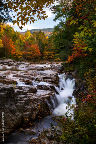 Indian Summer in New Hampshire, USA. A scenic view of the Swift river flowing during autumn.