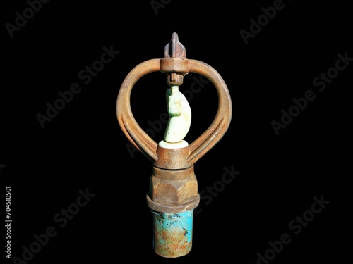 antique copper pipe, sprinkler ​isolated​ on​ black​ 