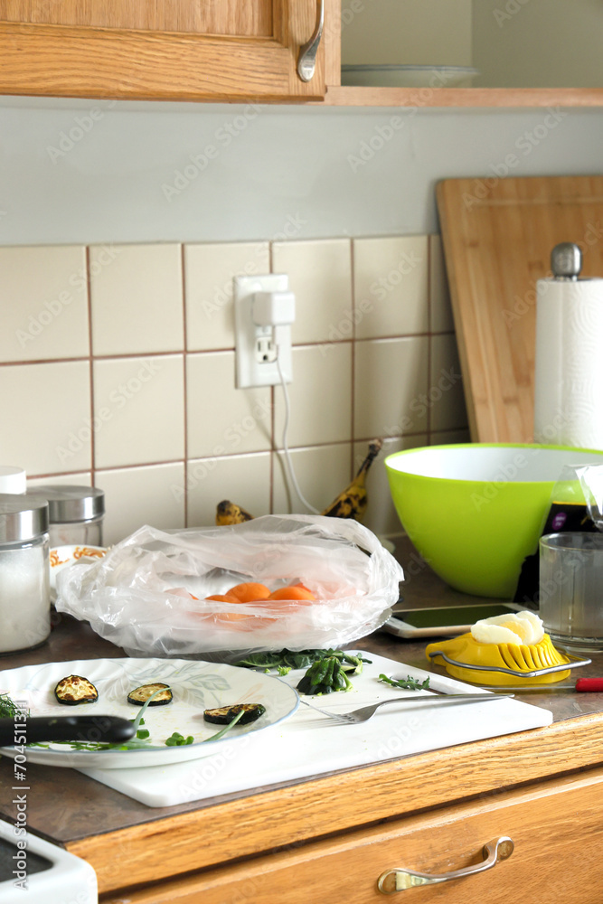 Kitchen mess with dirty utensils and food Kitchen mess with dirty utensils and food