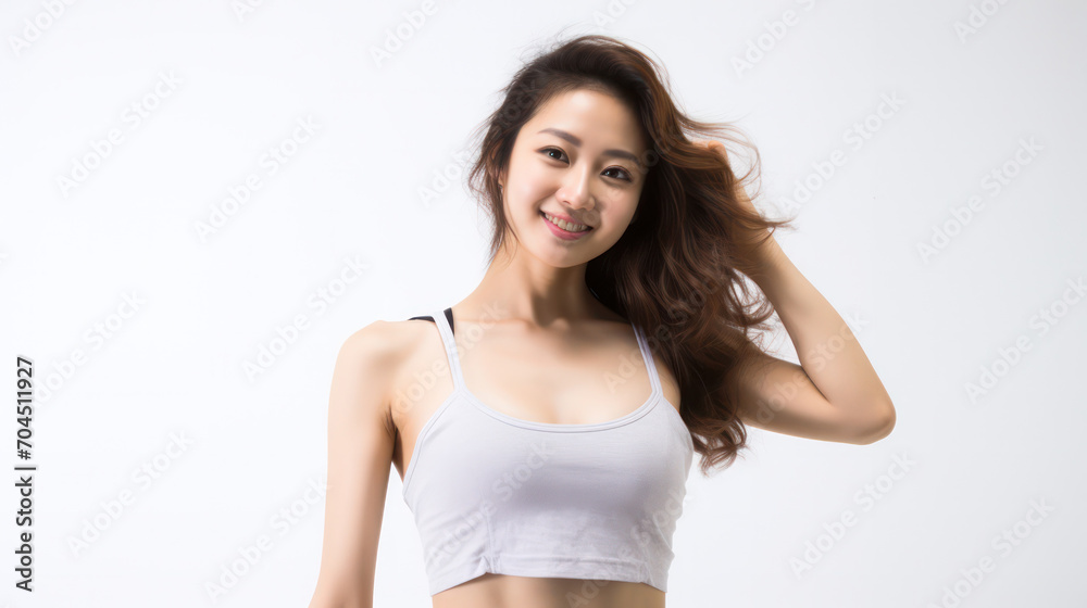 Asian Woman in Fitness Attire - A focused look on a white background with a sporty outfit. Asian Woman in Fitness Attire - A focused look on a white background with a sporty outfit.
