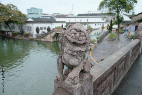 lion statue in front of Chinese building