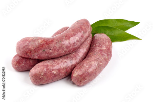 German Oktoberfest Sausages with basil leaf, close-up, isolated on white background.