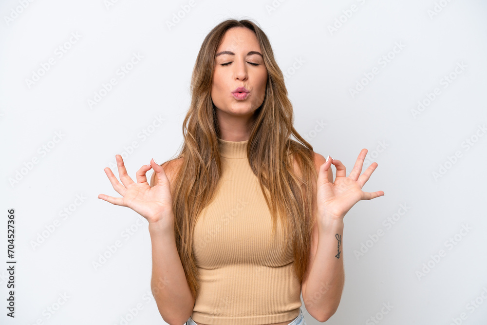 Young caucasian woman isolated on white background in zen pose Young caucasian woman isolated on white background in zen pose