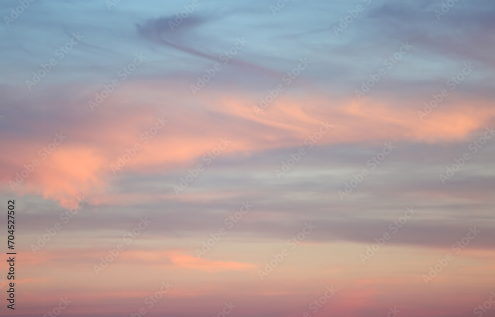 pastel colors from the sunset in the sky without sun with the colorful clouds
