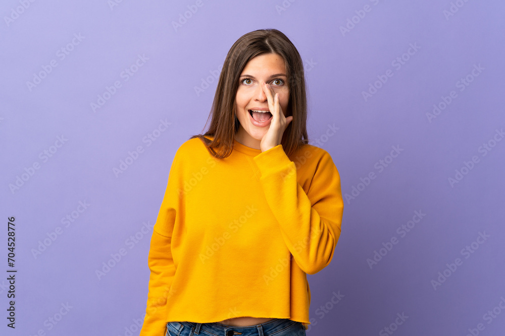 Young Slovak woman isolated on purple background shouting with mouth wide open Young Slovak woman isolated on purple background shouting with mouth wide open