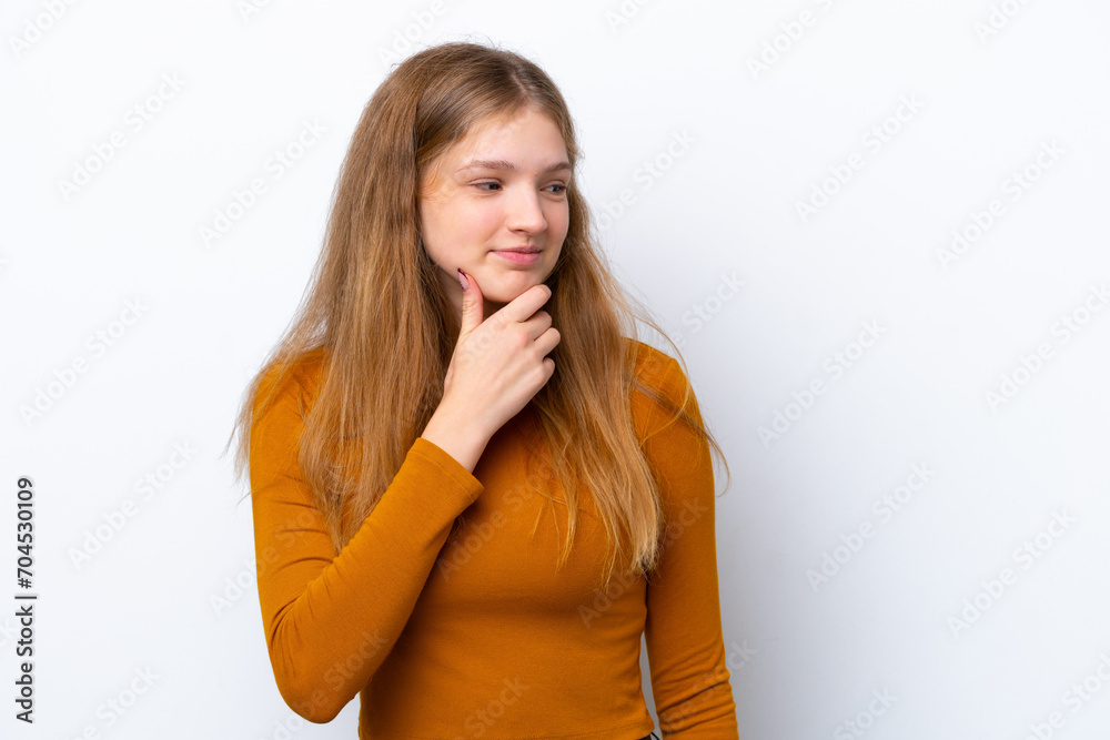 Teenager Russian girl isolated on white background looking to the side and smiling Teenager Russian girl isolated on white background looking to the side and smiling