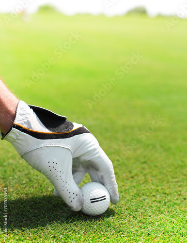 Golf player man holding golf ball