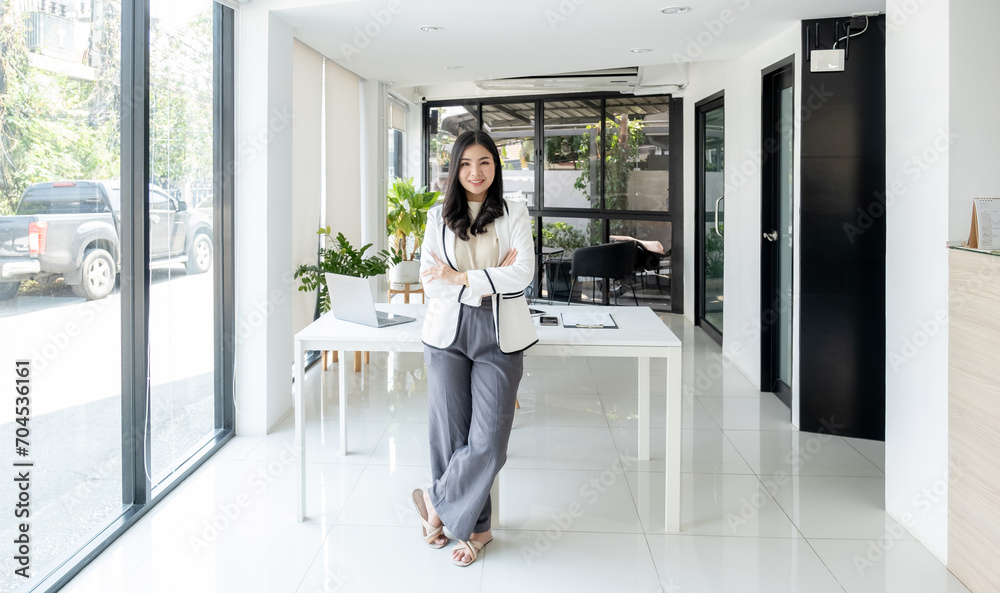Businesswomen management stand and plans strategies to increase business income. Have a working finance graph analysis and discuss the new target success Businesswomen management stand and plans strategies to increase business income. Have a working finance graph analysis and discuss the new target success
